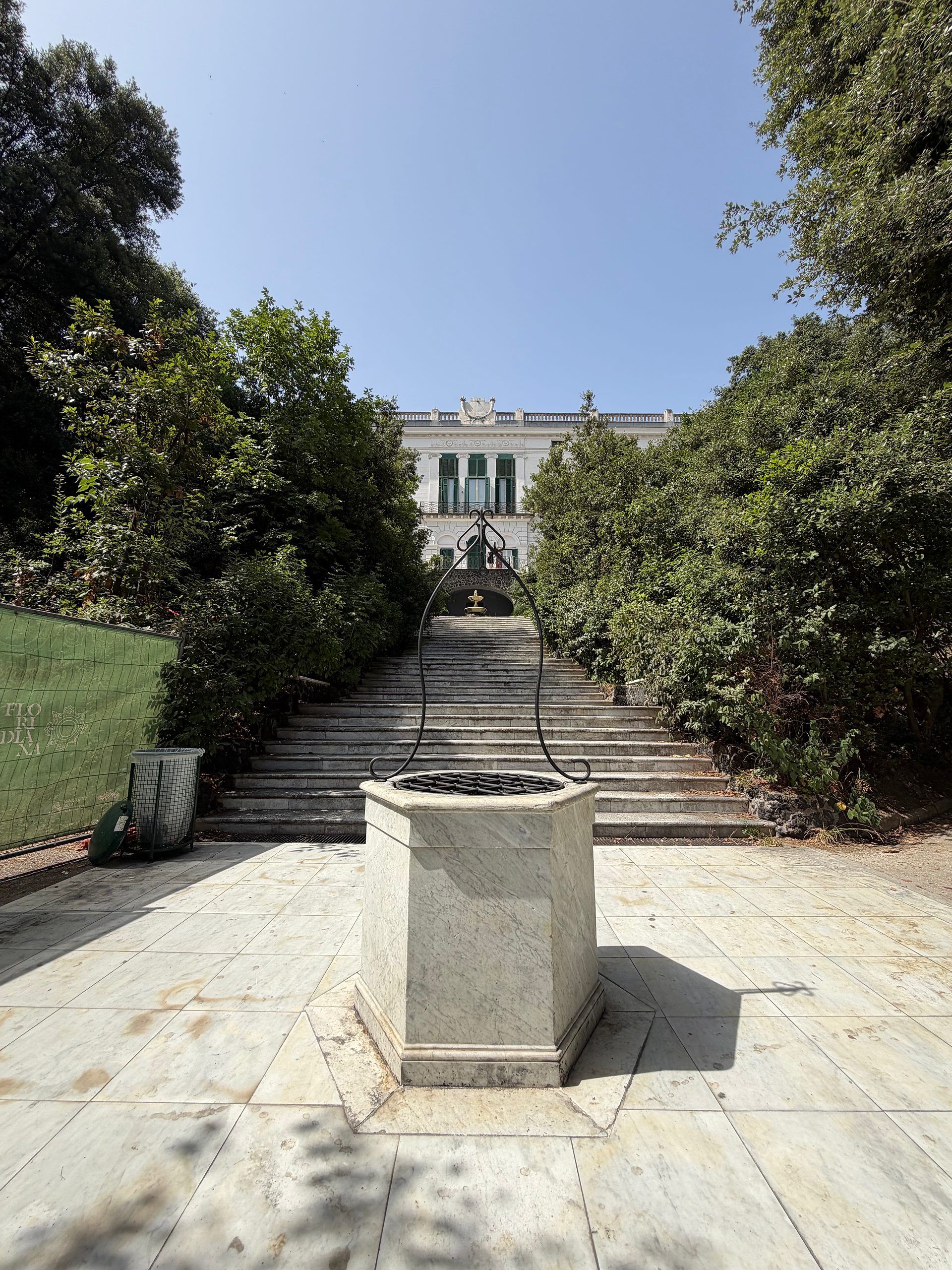 statue and back of villa flordiana from staircase