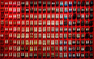 MICHELLE ANDONIAN
Elizabeth’s Shoes, 2013 (Photograph of 9 Rows of Shoes on red background)