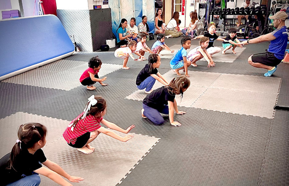 group of children squatting during gymnastics classes in Fitness in motion Tung CHung 