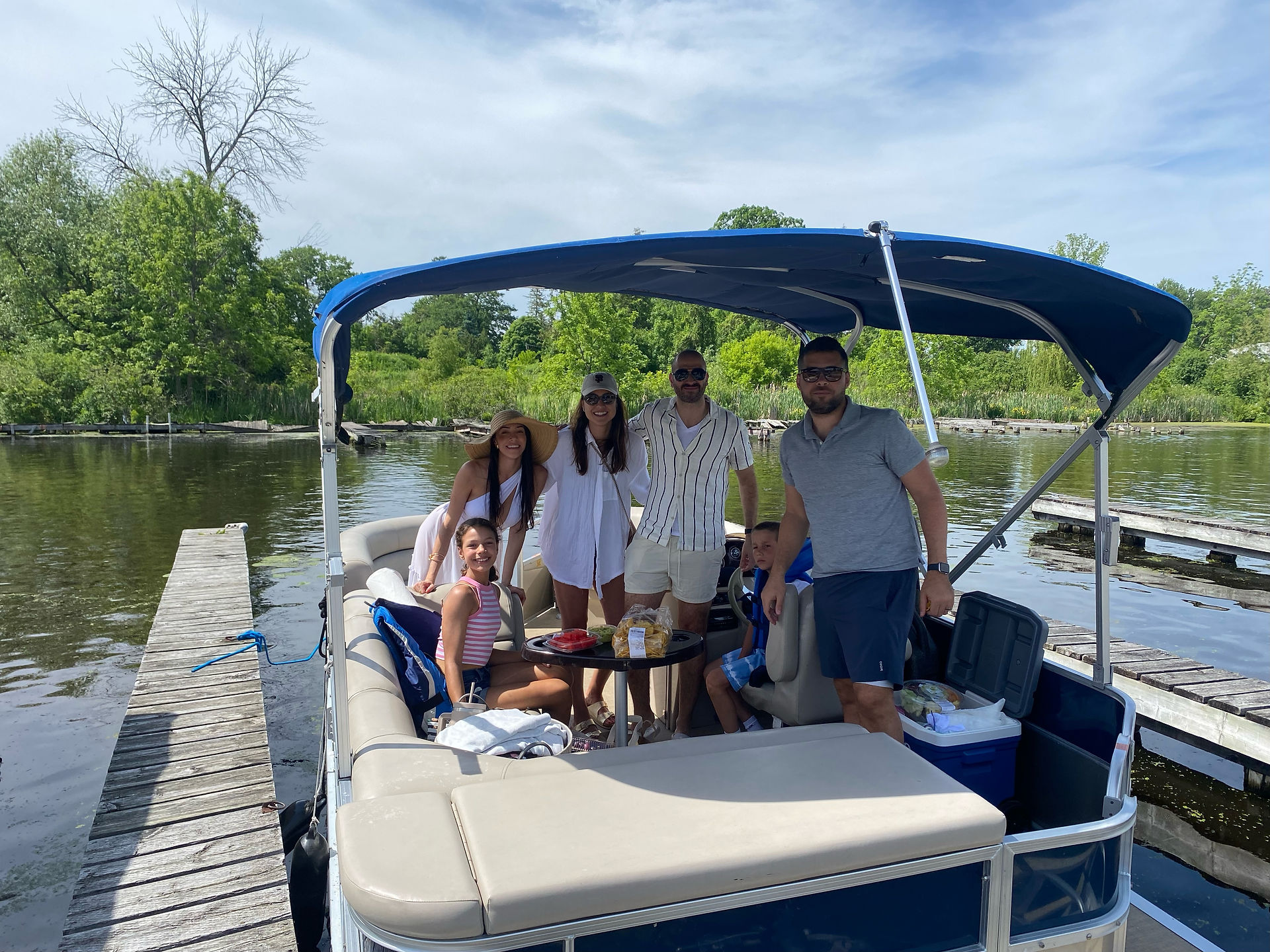 Family smiling on pontoon boat