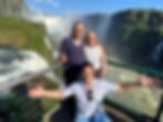 Couple and guide on the Iguazu Falls devils throat waterfalls