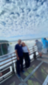 Couple with a licensed WS TOURS guide in front of Iguazu Falls on a private tour