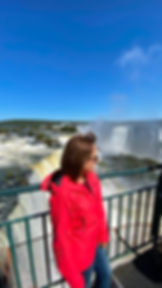 Woman traveling solo enjoying the viewpoint at Iguazu Falls, Brazilian side