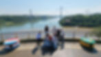 Group travelers at the Triple Frontier landmark in Puerto Iguazú, Argentina