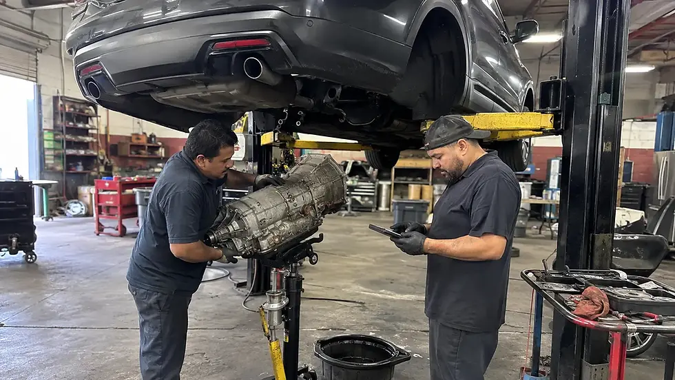 Mechanic diagnosing a used transmission fitment mismatch