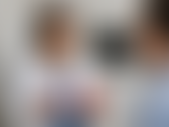 "Dr. Harkirat Kaur Aulakh at Profile Dental in Elk Grove explaining the difference between dental implants and dental bridges using models in a modern dental clinic."