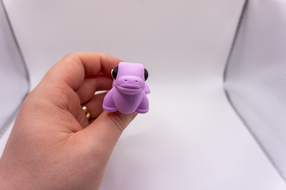 Thumbnail: Flexi Stegosaurus Keychain - held in hand
