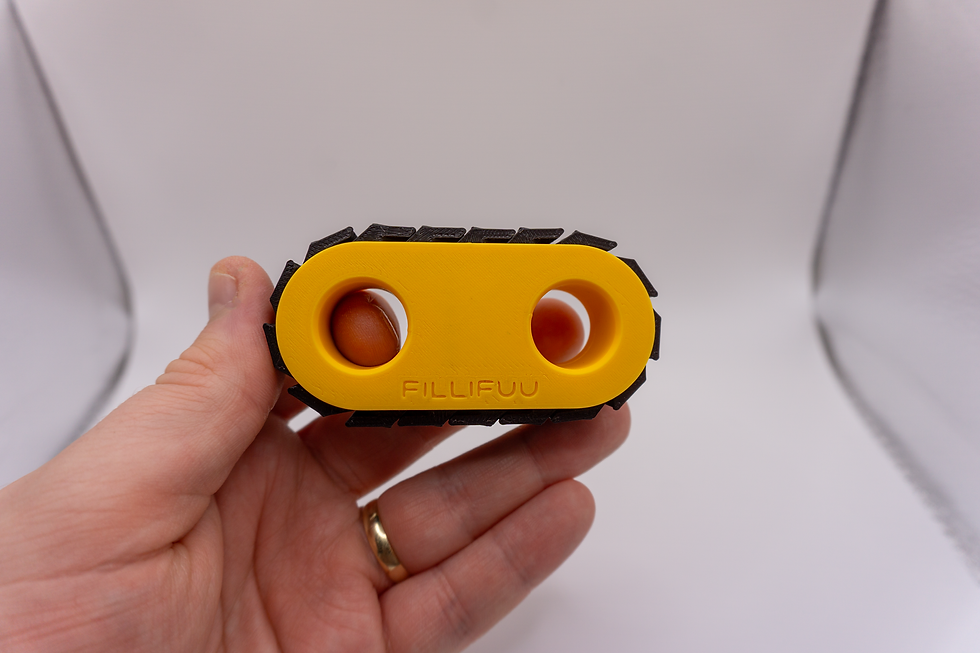 Thumbnail: Yellow Track Clicker Fidget Toy - held in hand