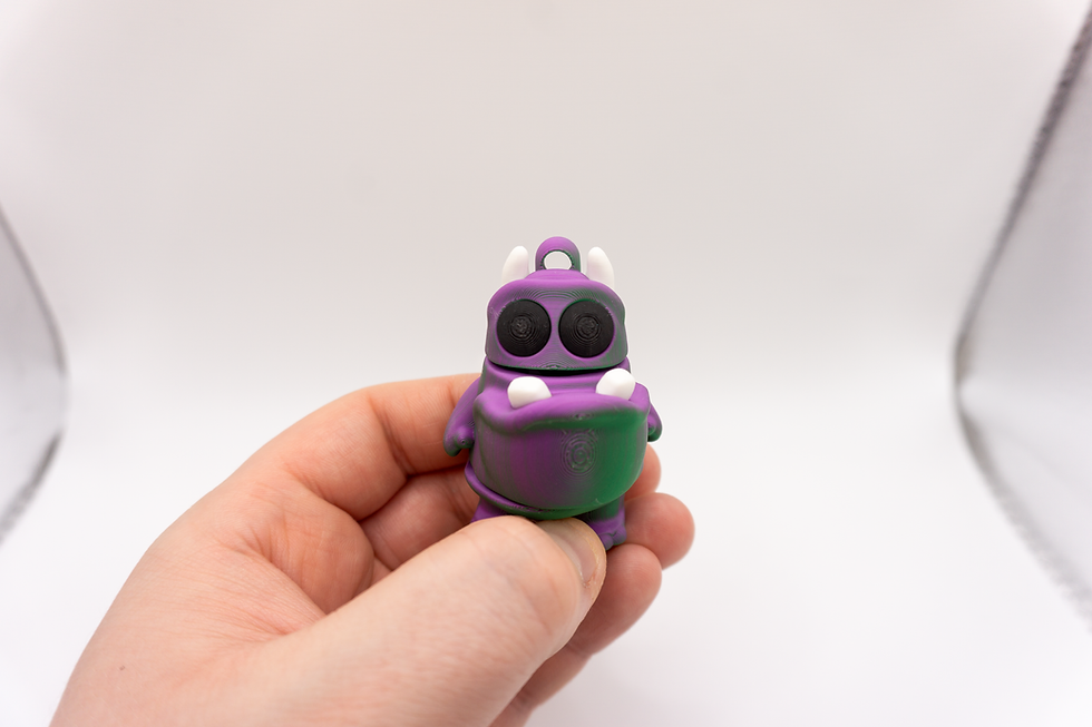 Thumbnail: Chomp – Flexi Alien Keychain - held in hand