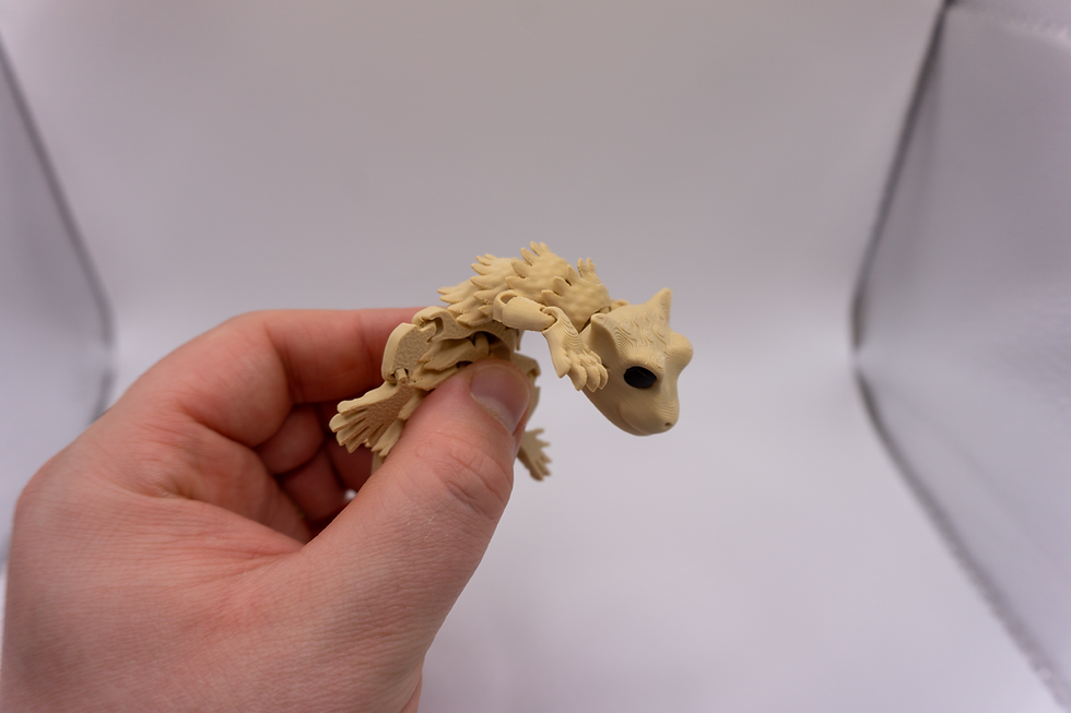 Thumbnail: Flexi Bearded Dragon Keychain - desert tan held in hand 2