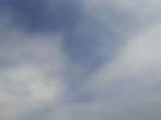 Cirrocumulus zusammen mit Cirrus spissatus: könnte eine Aufzugbewölkung anzeigen