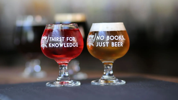 Two beers. One beer with text "Thirst for knowledge". The other beer with text "No books, just beer".