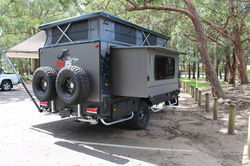 Gas strut assited bed compartment