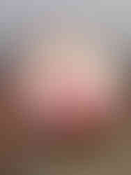 A cake covered in pink buttercream flowers