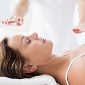 Hands hovering over person's face