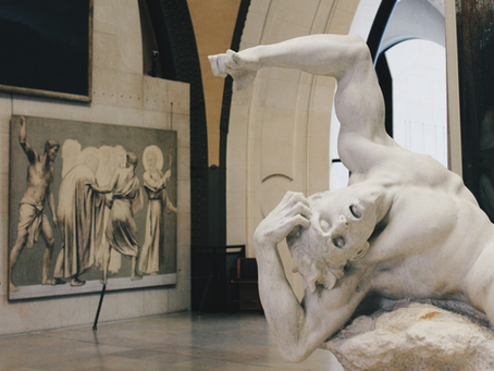 statue d'um homme douleur a la tete