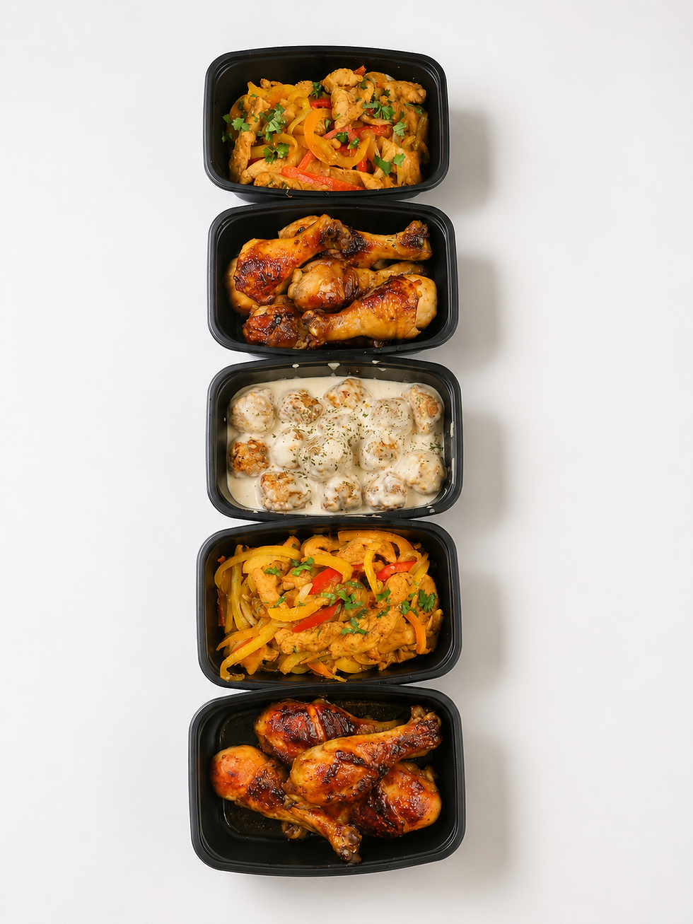 Healthy Latin-inspired meal prep containers with gourmet chicken and fresh vegetables by Kusi House.