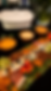 Gourmet catering charcuterie board with cured meats, cheeses, and fresh fruit by Kusi House.