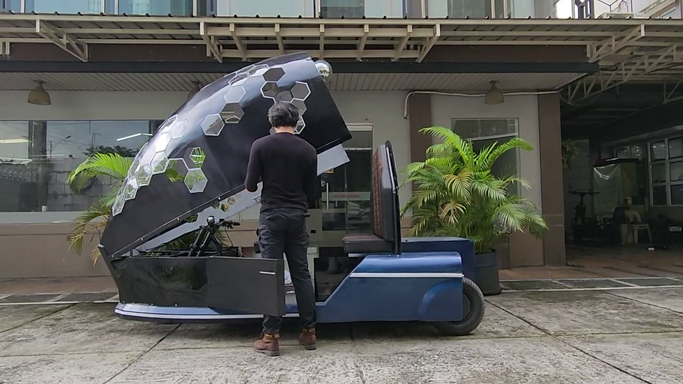 Lycan founder opening the canopy of the BubbleTuk EV prototype