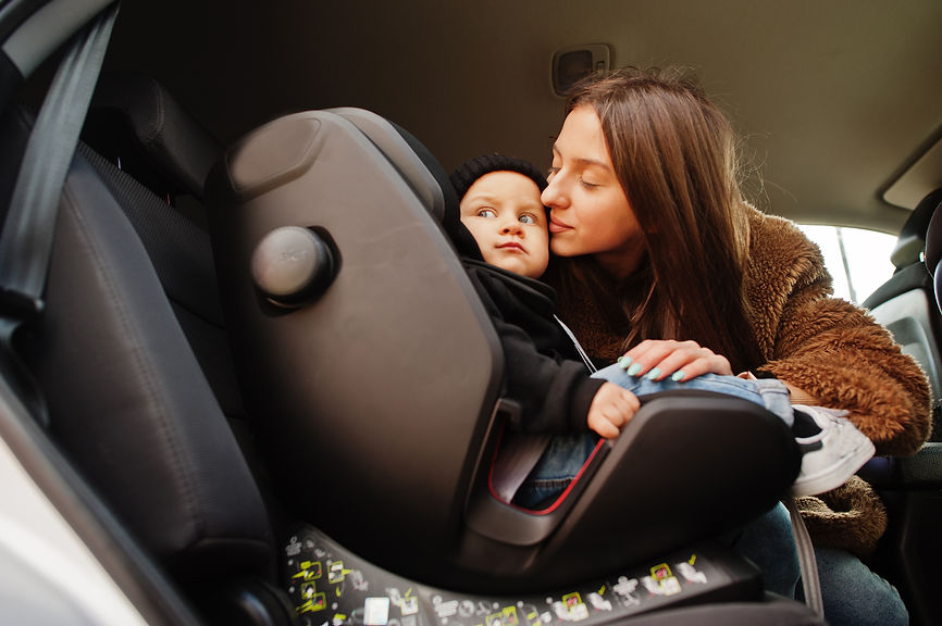 young-mother-and-child-in-car-baby-seat-on-chair-safety-driving-concept (2).jpg