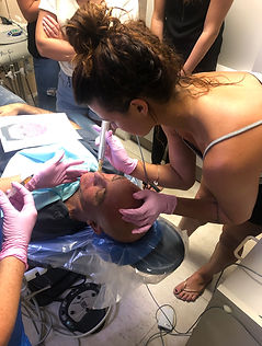 Students getting hands on training in PRF Facial Aesthetic course