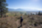 Three hikers take in the views from the top of Balancing Rock Trail
