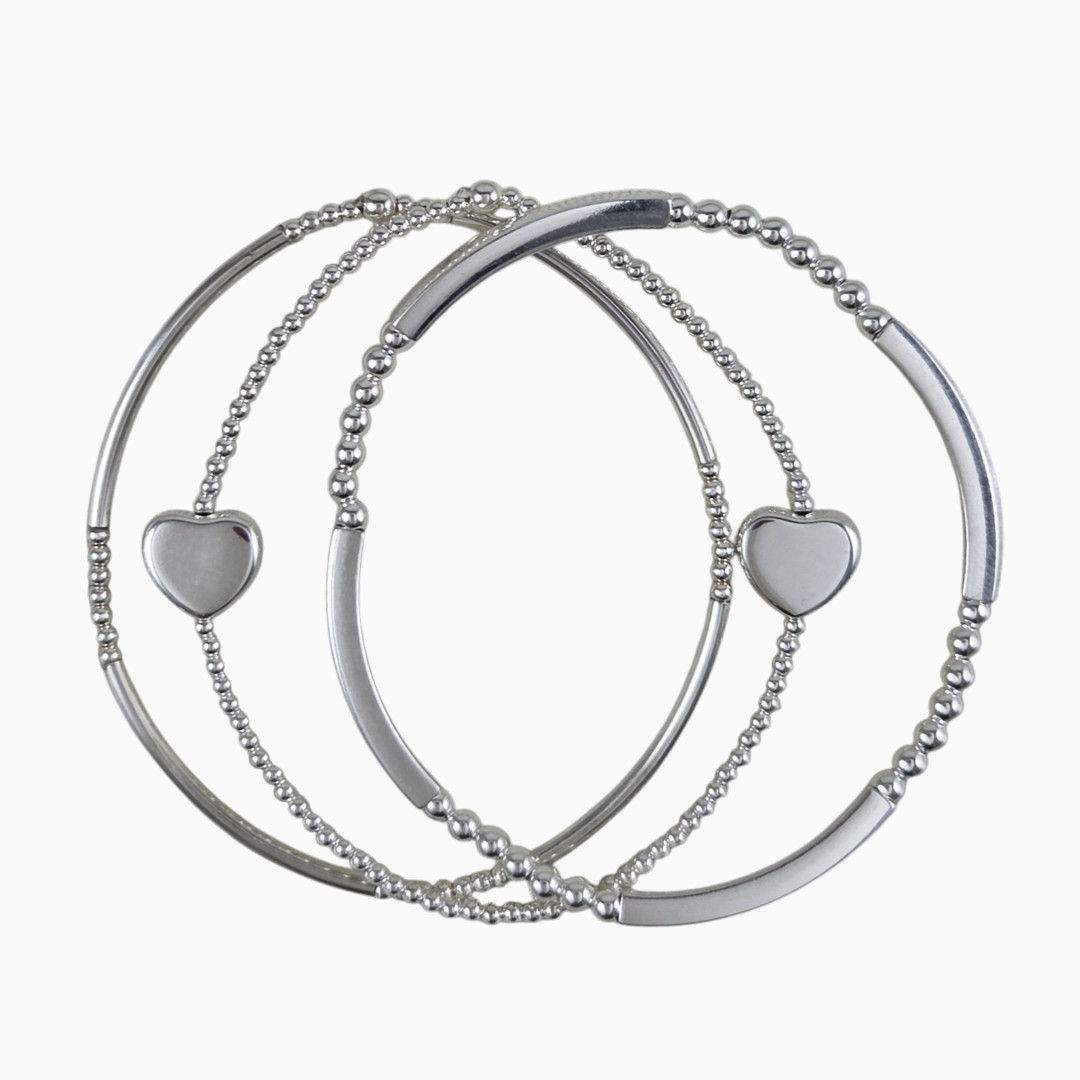 three sterling silver stretch bracelets one with heart beads | www.elizaperry.com