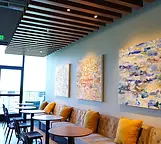 Bright member lounge with comfortable seating at Flyte Racquet Club