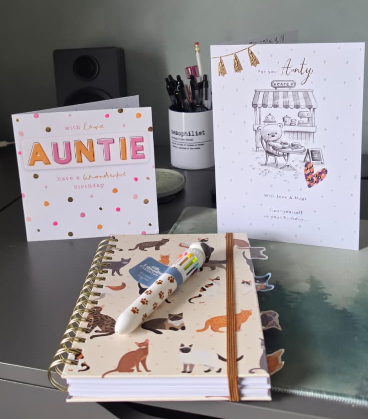 My two Auntie birthday cards and present chosen by my nephews - a cat notebook and multicoloured pen.