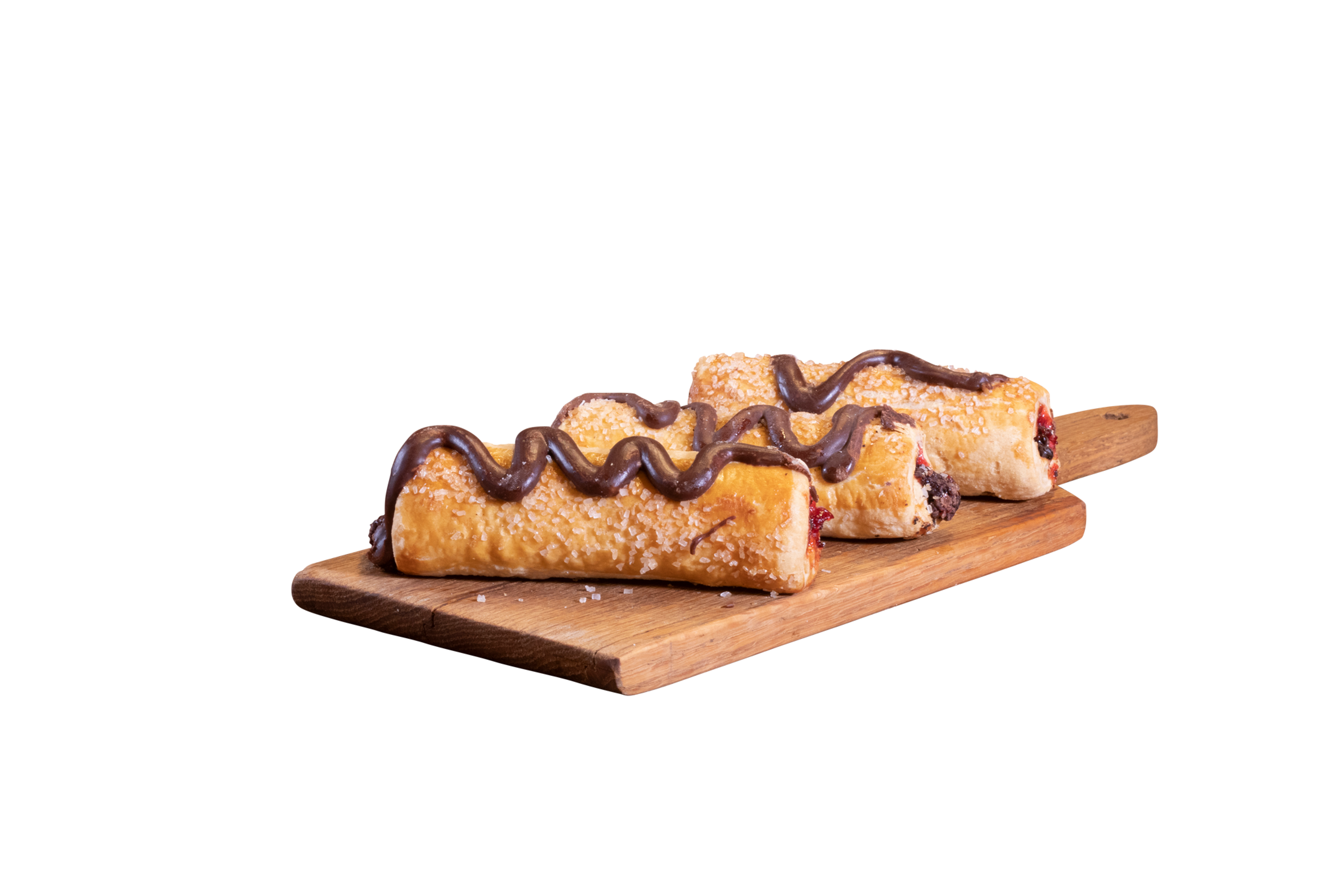 Pastries with chocolate drizzle on wooden board, delicious treats for enjoyment.