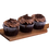 Thumbnail: Three chocolate cupcakes with rich frosting and sprinkles on a wooden board.