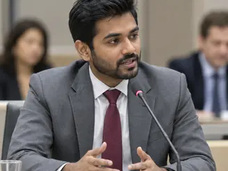 Speaker addressing delegates at a policy conference
