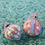 Thumbnail: A set of two marbled ceramic baubles in light blue, purple and red, with velvet ribbon.