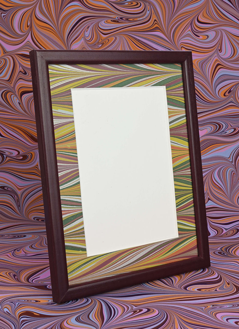 Thumbnail: A painted burgundy photo frame with marbled mount to fit a 6 x 4 photo.
