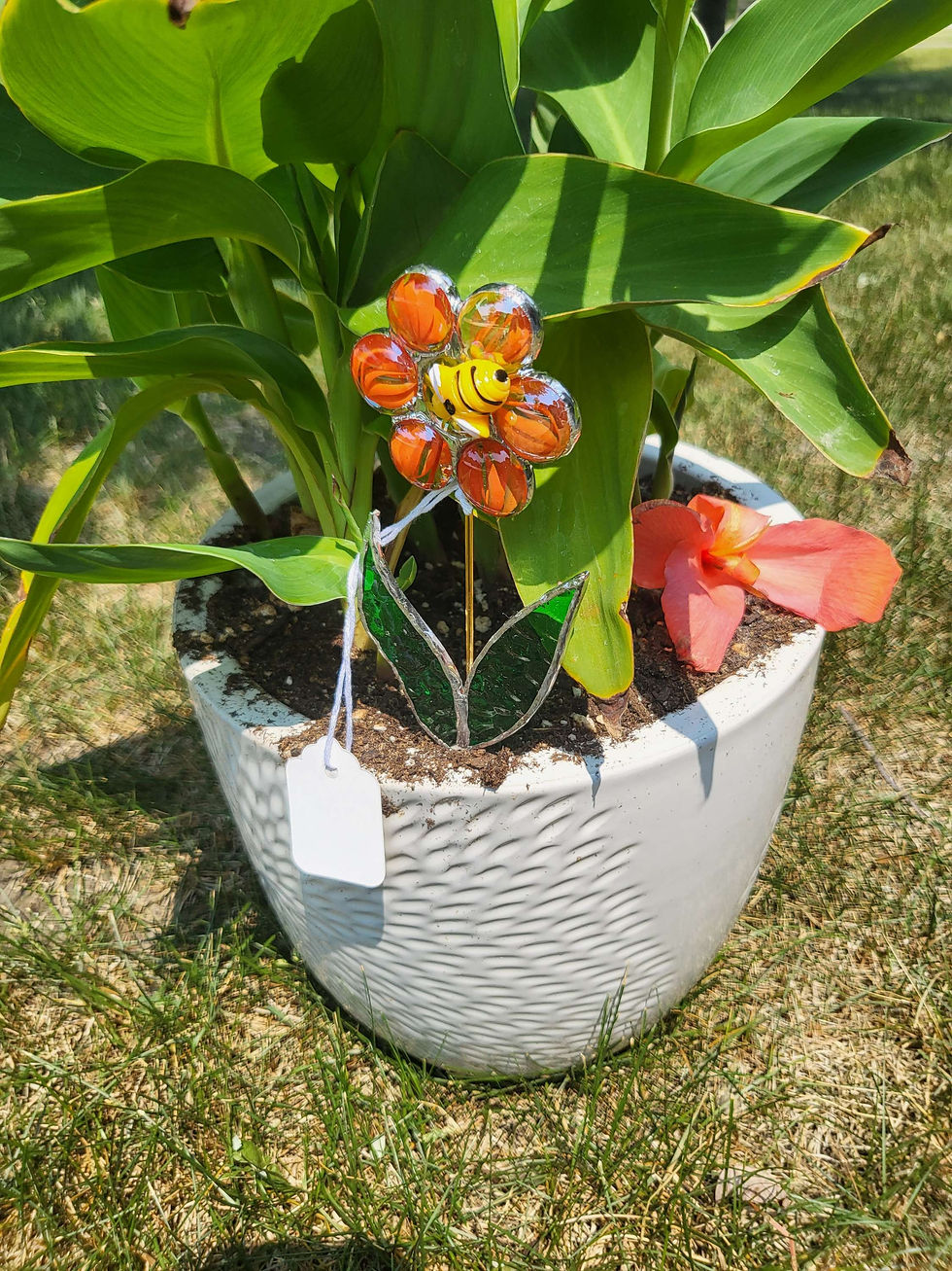 Thumbnail: White potted plant with Glass Rock Flower Stake with Resin Bee. Close up.