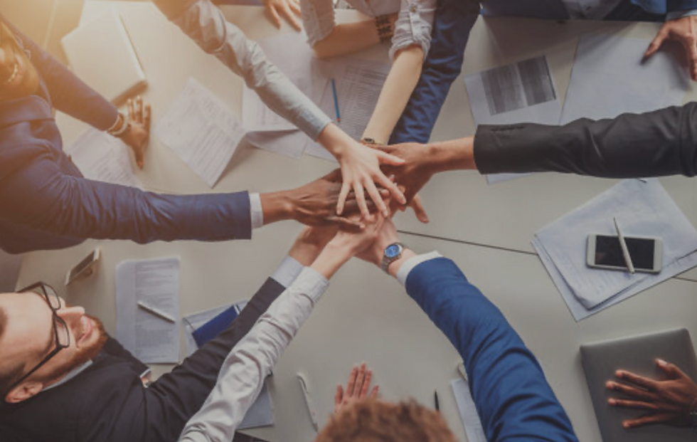 a professional group of diverse team members in an open, collaborative workspace