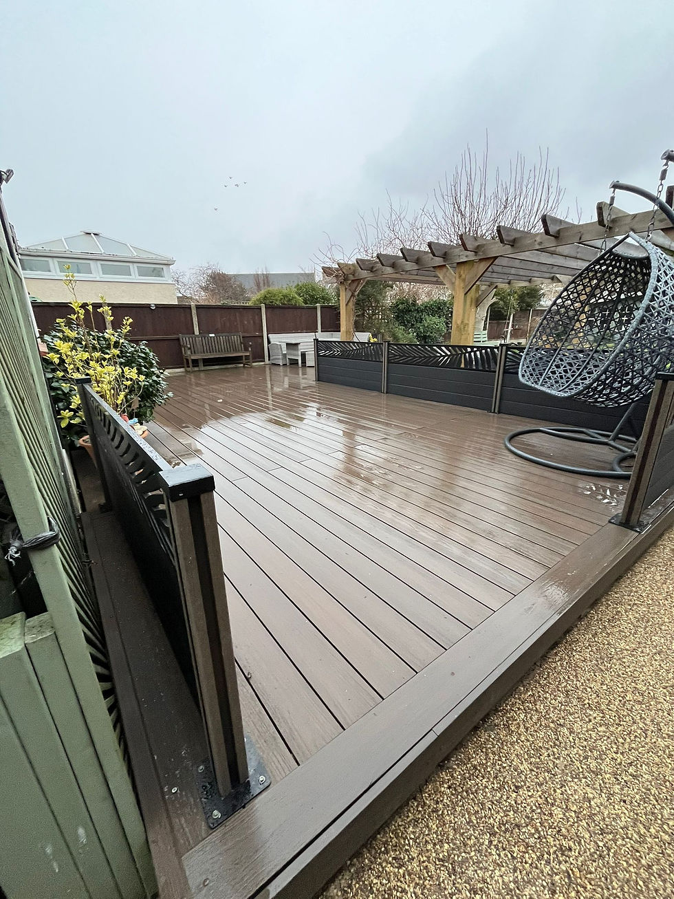 Bronze Mighty Crown Capped Composite Decking with Ash Composite Fencing with Palm Trellises 