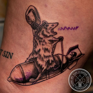 opossum on a rocket tattoo