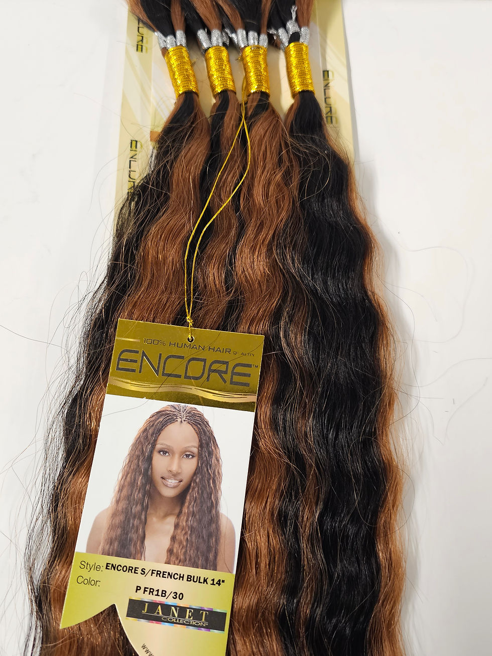 Thumbnail: Encore two-toned brown and black wavy hair extensions in packaging