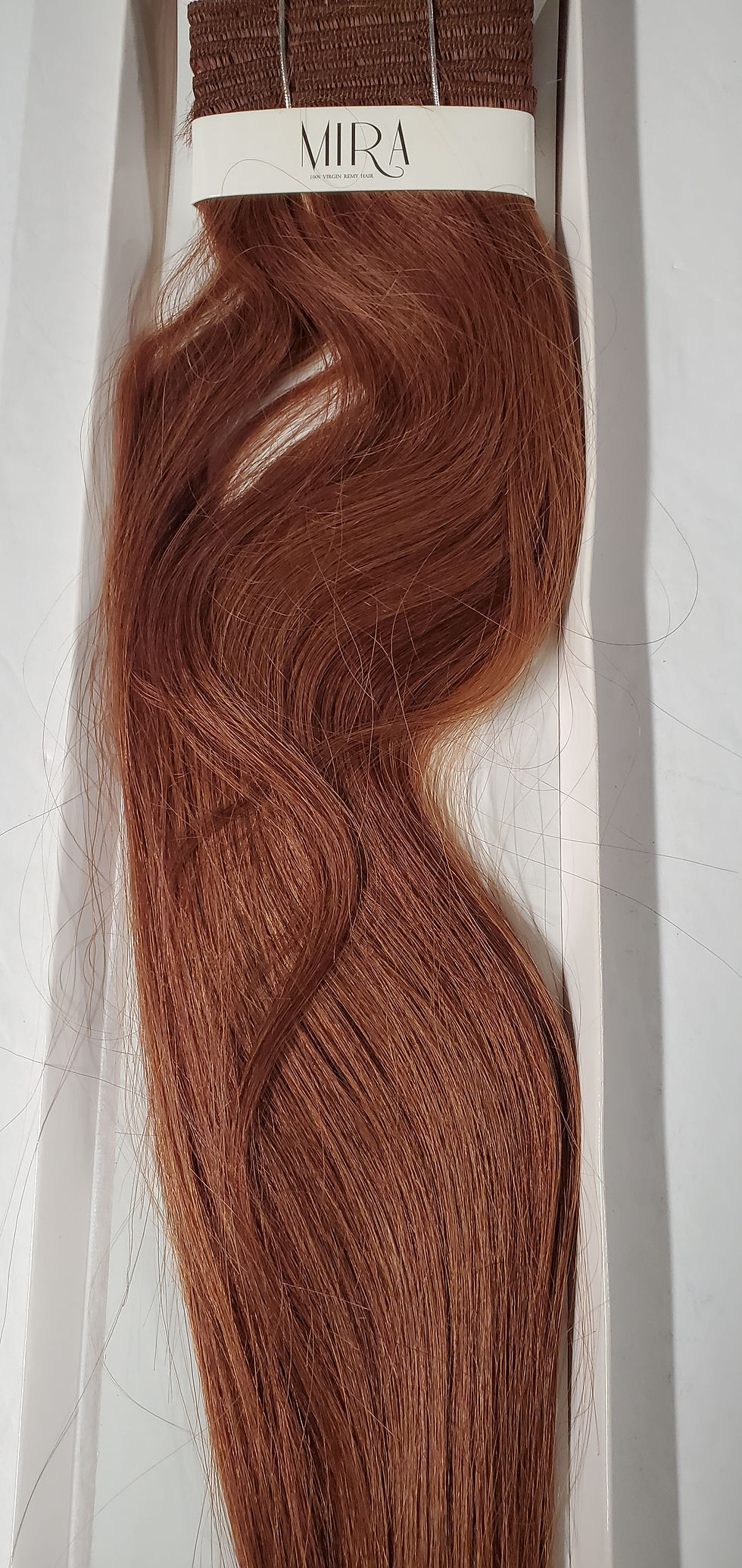 Thumbnail: Reddish-brown wavy hair swatch