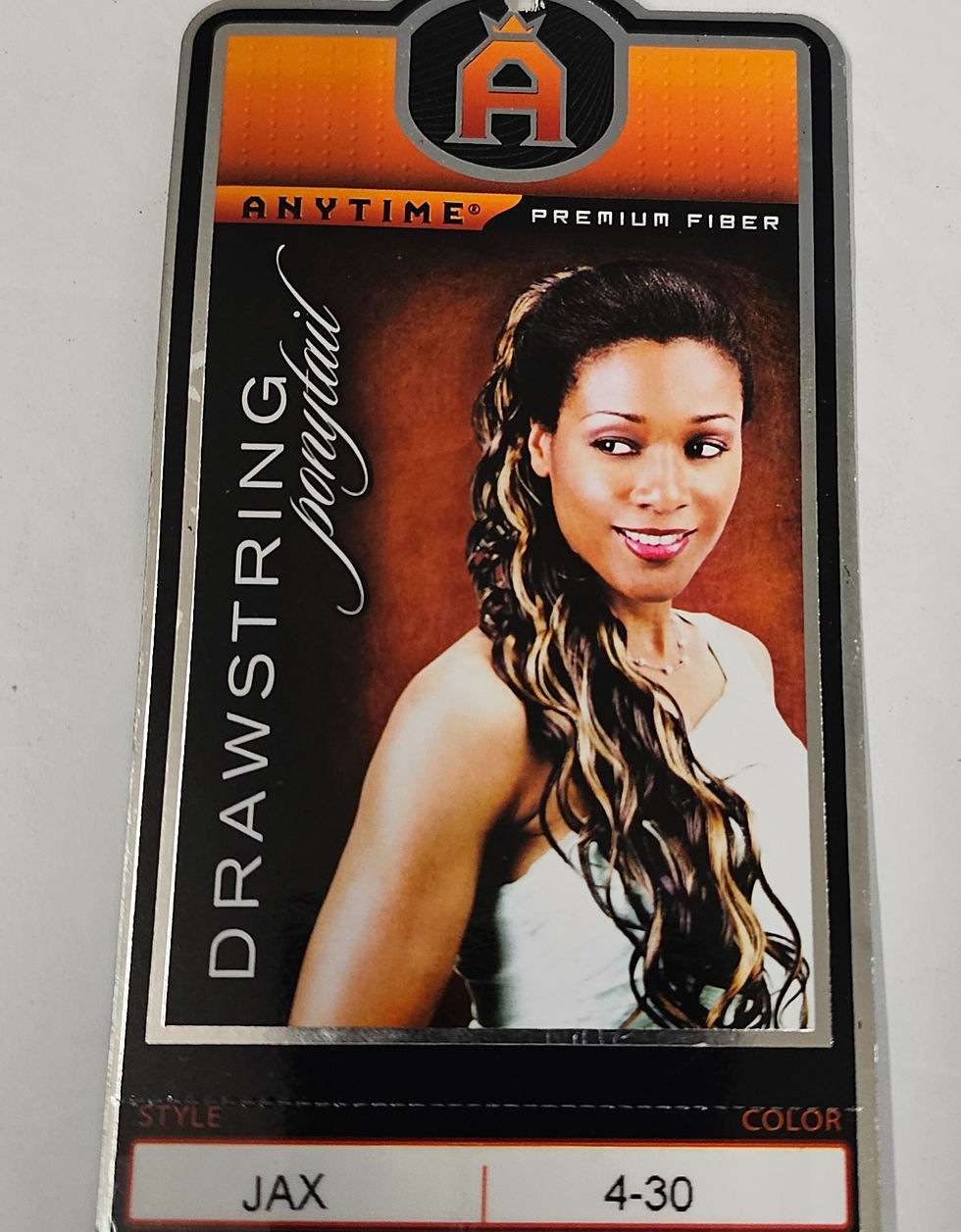 Thumbnail: Drawstring ponytail package with woman's long wavy hair