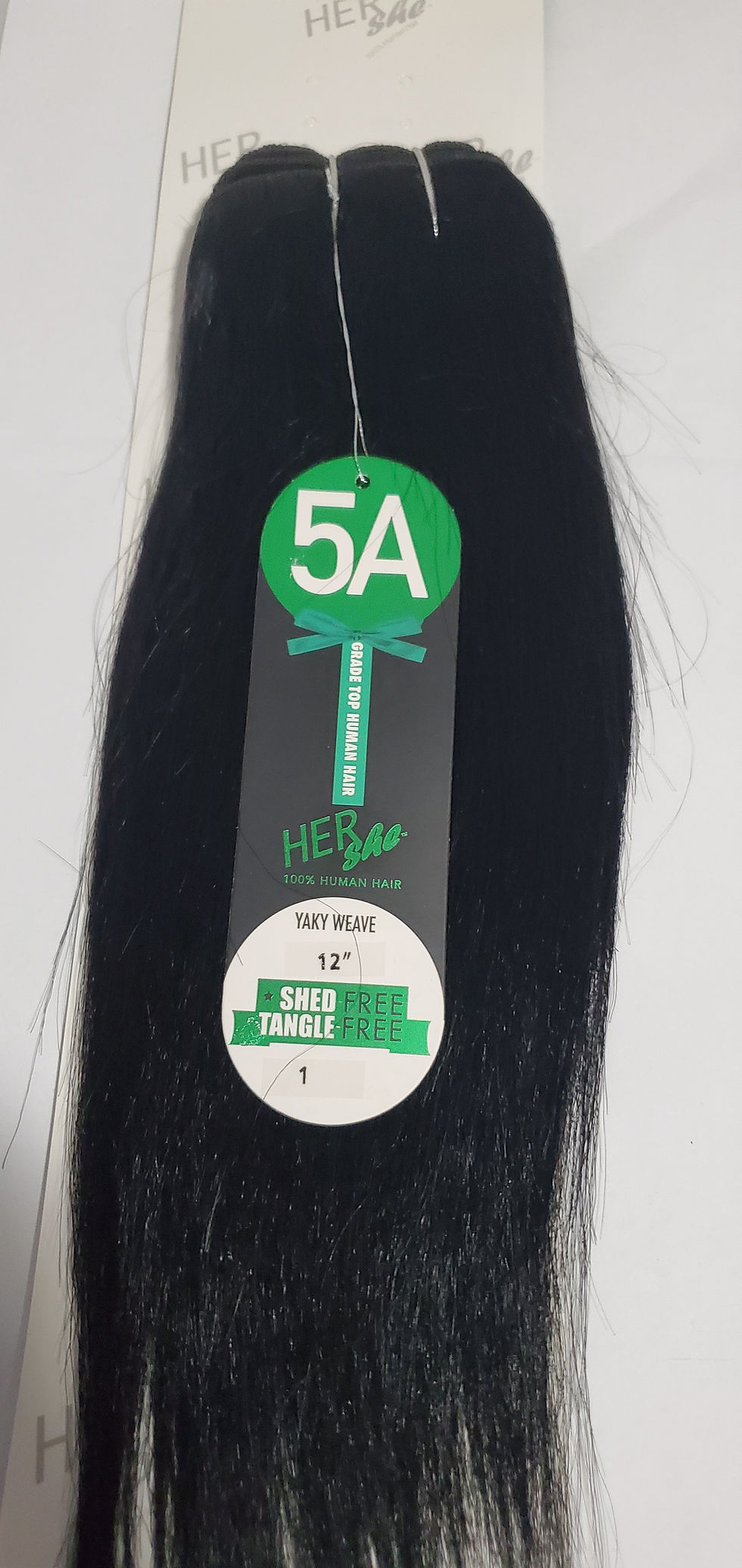 Thumbnail: Hair extensions with '5A HER HAIR TAPE WEAVE 12''' tag