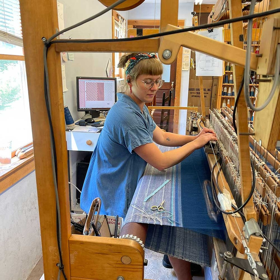 Swans Island Company worker weaving one of their handcrafted blankets.