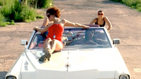 Sitting on a Convertible pushed by Nelly Furtado
