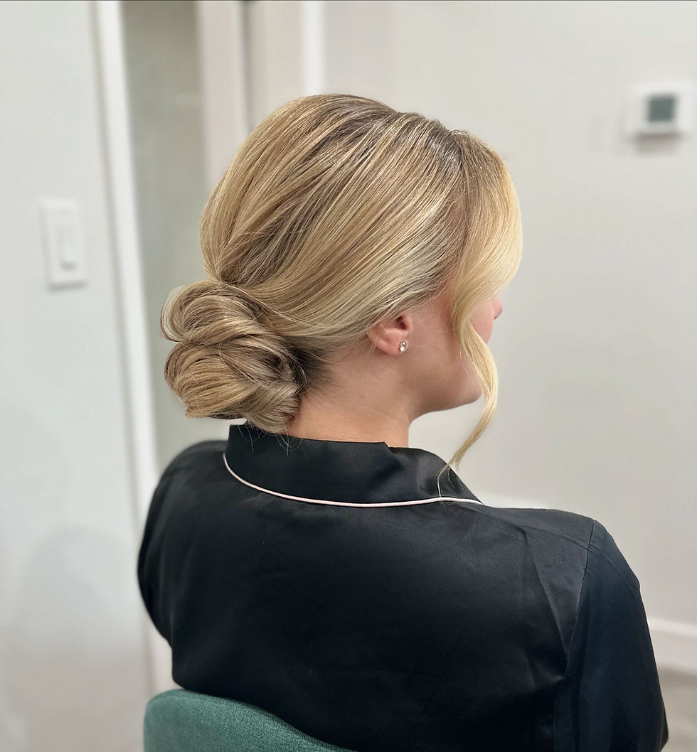 Eye-level view of bridesmaid with elegant chignon hairstyle
