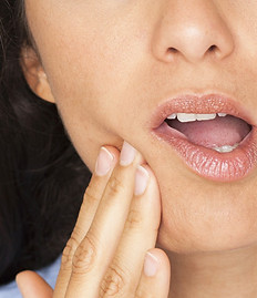 A person in mouth pain