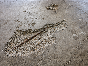 Why Nebraska Garage Floors Fail — And What Homeowners Can Do Before It Gets Worse
