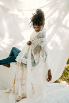 East Texas photographer in front of a white sheet