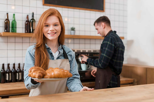 front-view-barista-girl-with-croissants2.jpg
