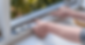 hands inserting rubber foam sealant in window